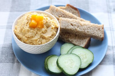 butternut squash hummus on plate with cucumbers