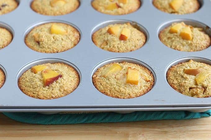 peach muffins baked in muffin tin
