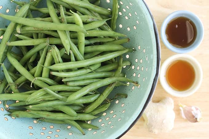 ingredients in sesame green beans with green beans, soy sauce, ginger, garlic