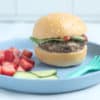 zucchini-burger-on-bun-on-blue-plate