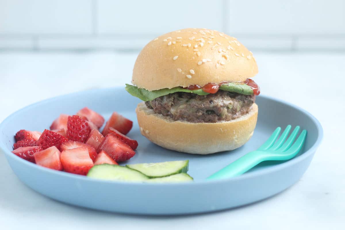 zucchini-burger-on-bun-on-blue-plate