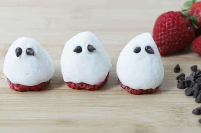 strawberry ghost Halloween treats on cutting board