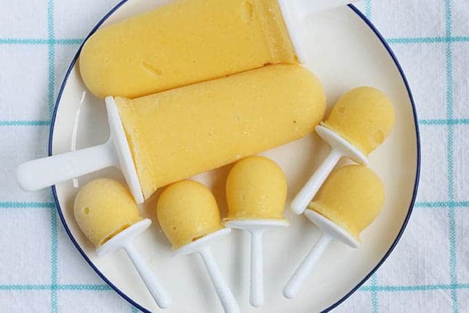 mango-popsicles on white plate