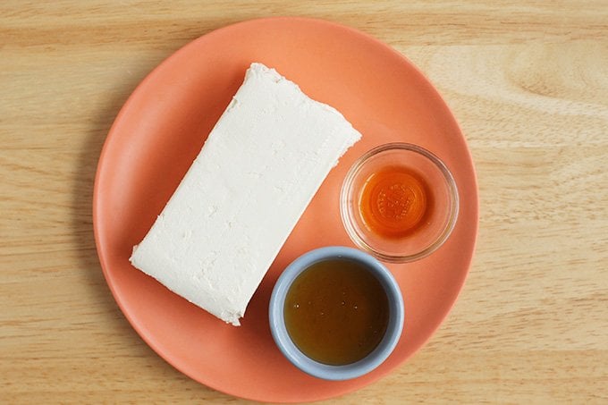 cream cheese frosting ingredients on orange plate
