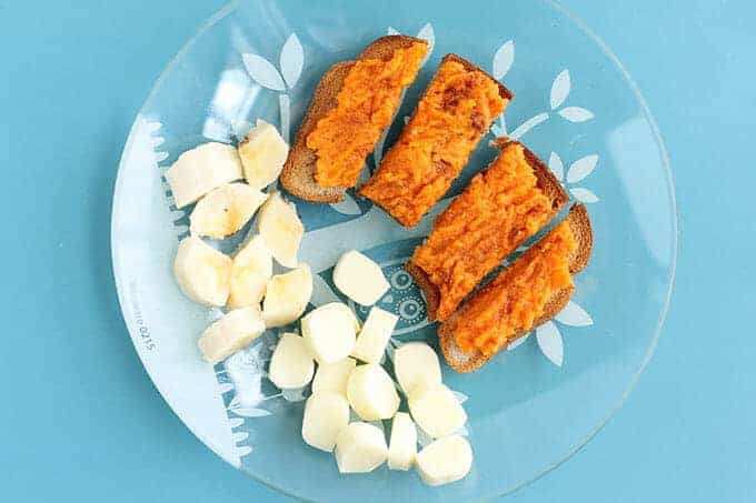 toddler breakfast idea sweet potato toast with banana on a clear plate 