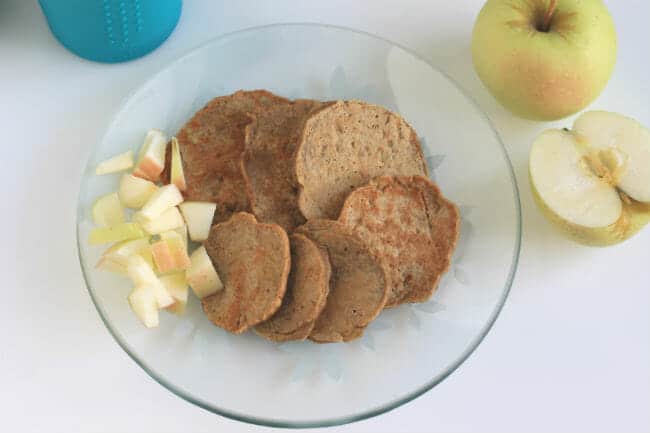 toddler meal idea pancakes for breakfast on glass plate with apple cubes