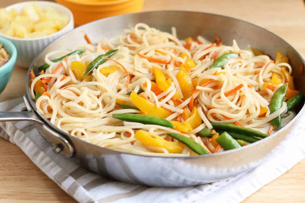 stir fry noodles with vegetables in skillet