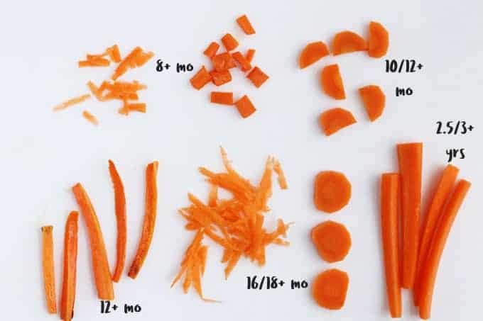 variety of shapes of carrots on cutting board