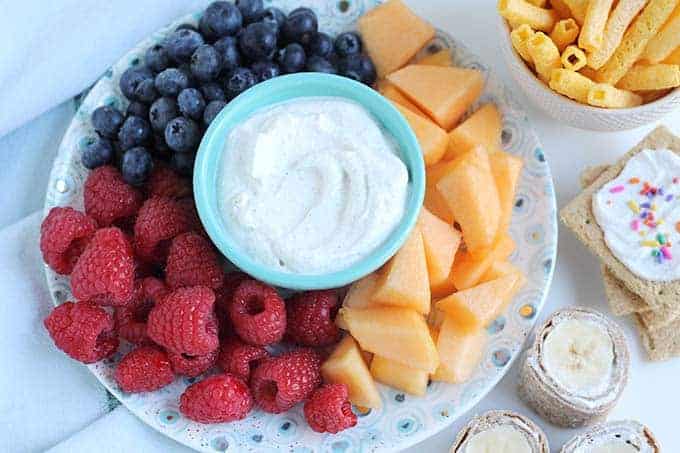 healthy cottage cheese spread with assorted fruit on plate