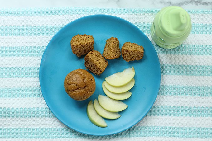 mini healthy pumpkin muffin on plate with apple