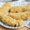 crispy baked chicken tenders on white and blue plate
