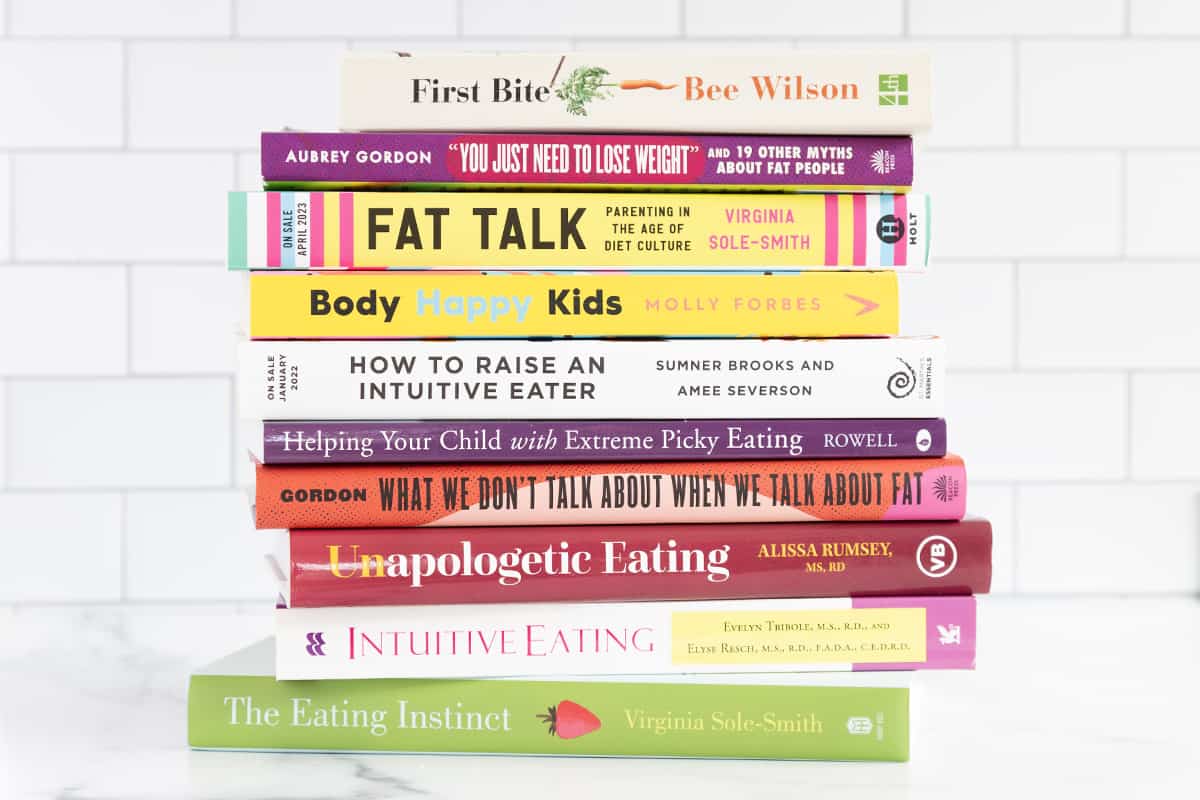 Stack of picky eating books on countertop. 