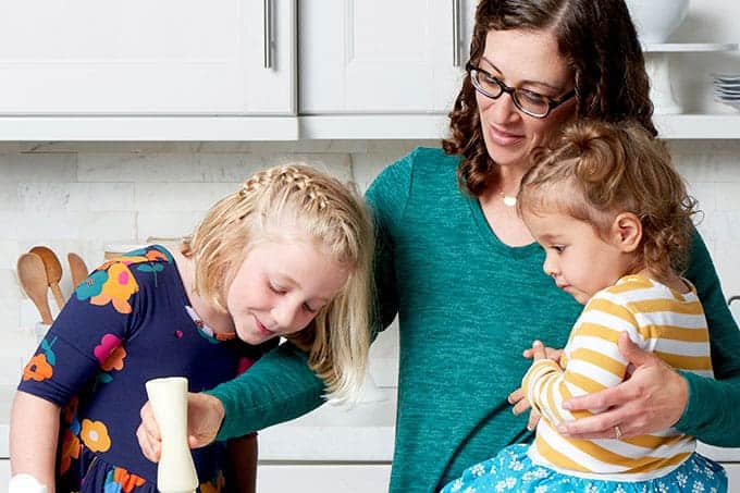 Amy Palanjian cooking with two kids