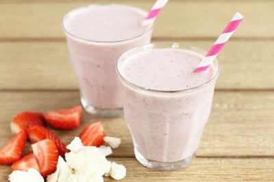 strawberry banana smoothie with cauliflower in glasses