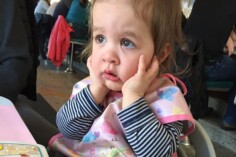 Toddler in restaurant highchair