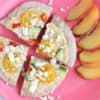greek pita pizzas on pink plate with peaches