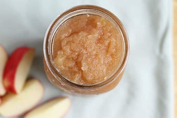 chunky applesauce in jar with apple slices