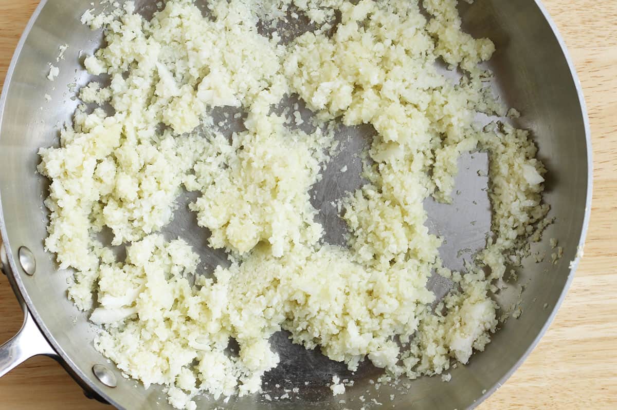caulifower rice cooked in stainless pot.