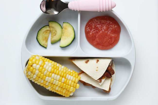 cut up vegetarian quesadillas for kids on plate