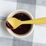 blueberry-puree-on-yellow-baby-spoon