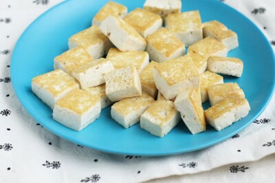 sesame tofu on blue kids plate