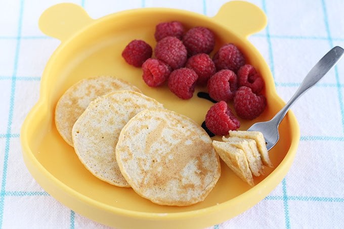 cottage cheese pancakes on child's plate with berries