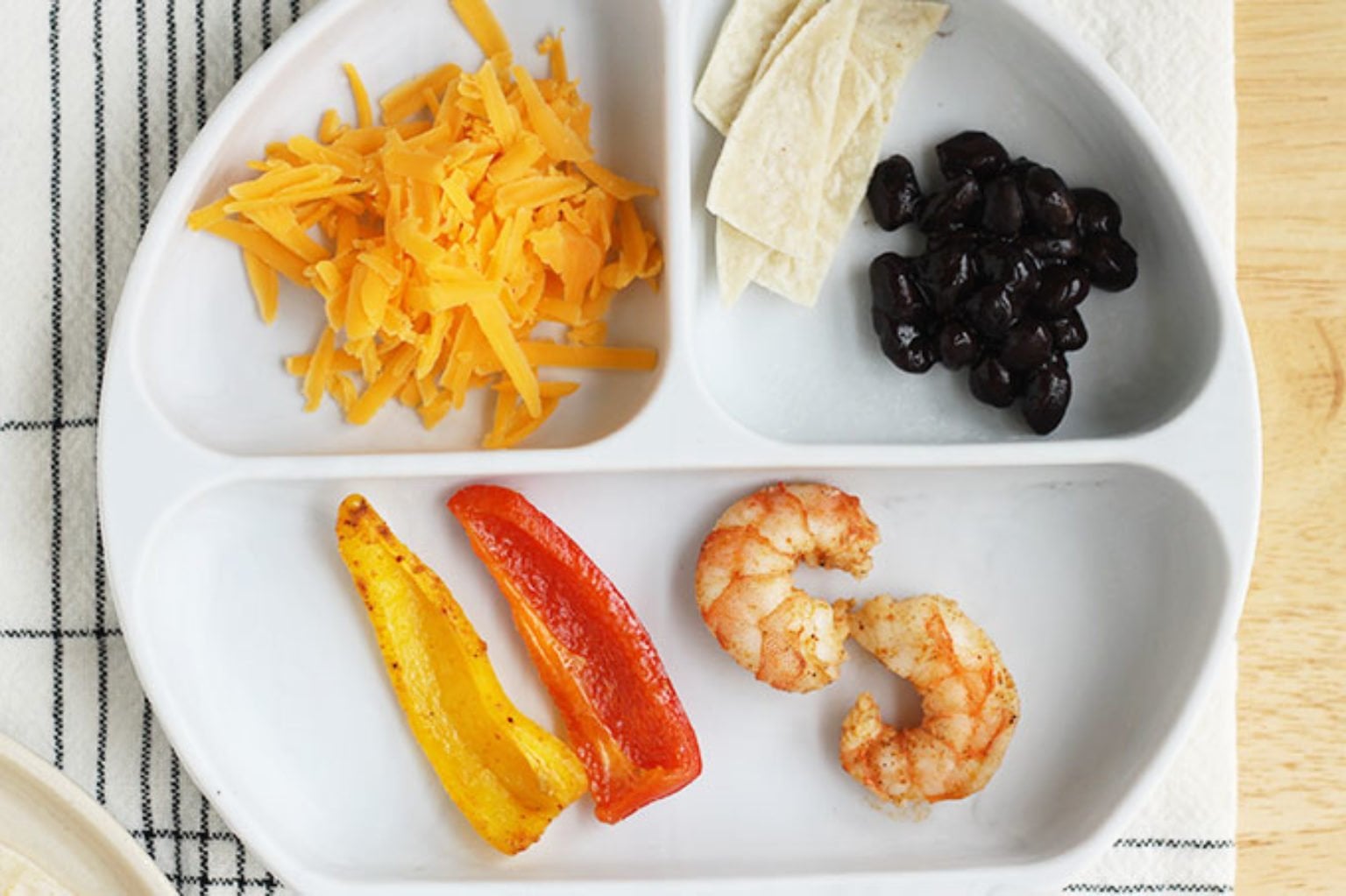 shrimp fajitas on divided plate
