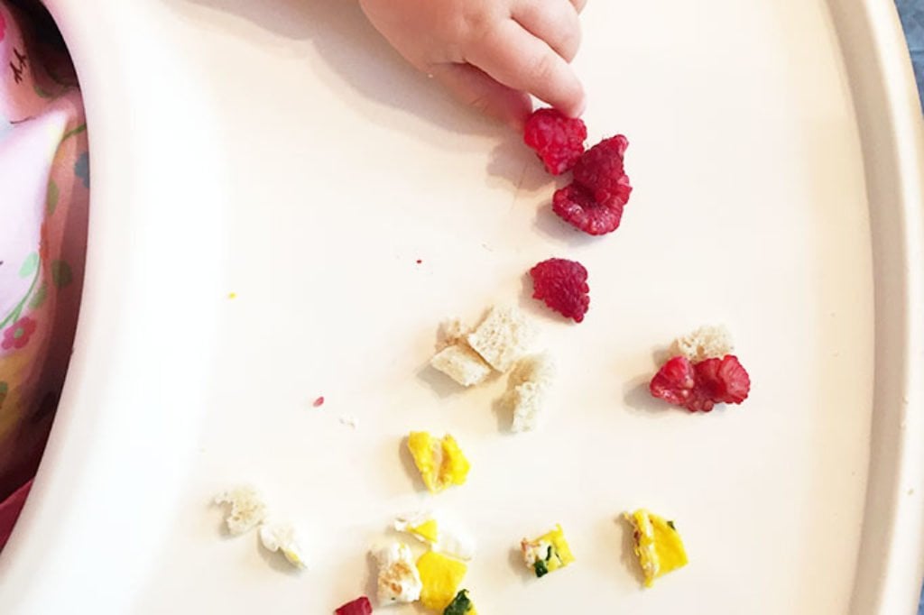 baby-eating-raspberries-and-egg