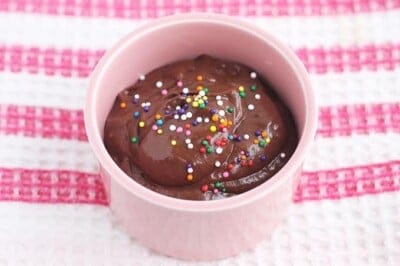 chocolate avocado pudding in pink cup