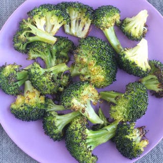 roasted broccoli on purple plate