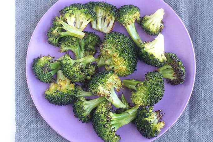 roasted broccoli on purple plate