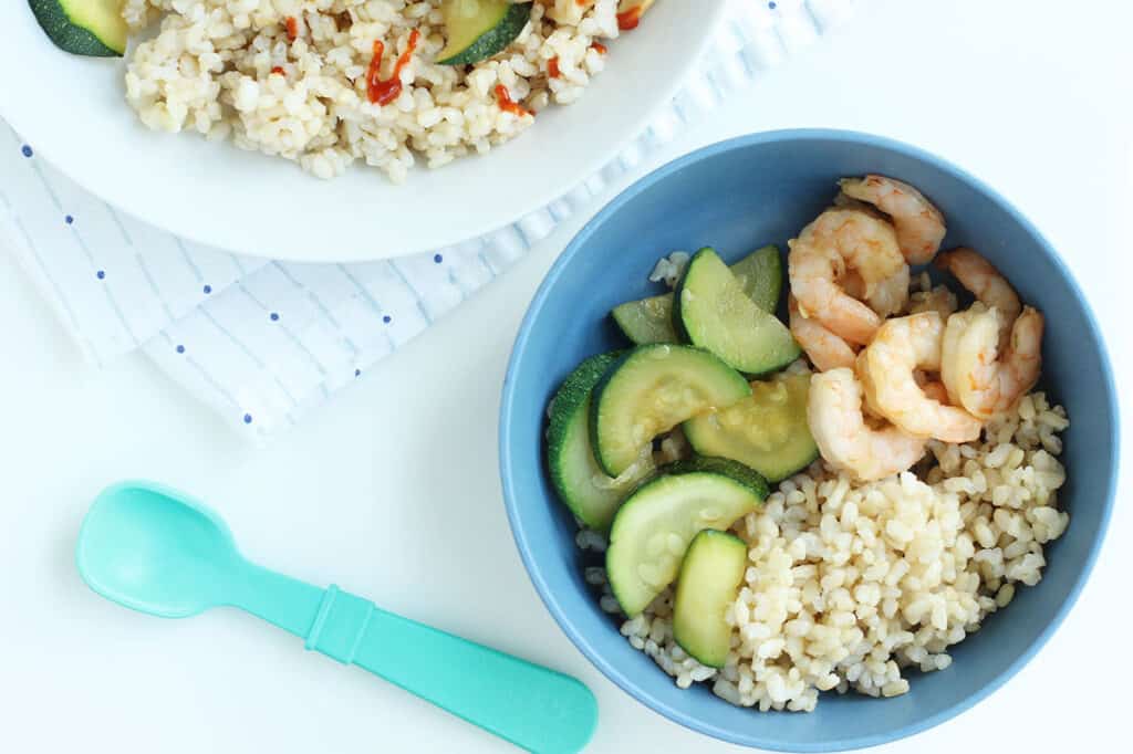 teriyaki shrimp stir fry in blue bowl.