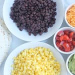 taco-buffet-ingredients-in-white-plates