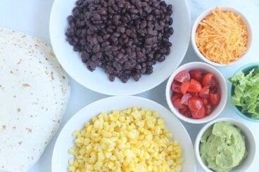 taco-buffet-ingredients-in-white-plates