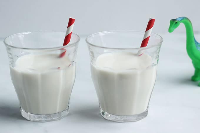 vanilla milk in cups with red straws