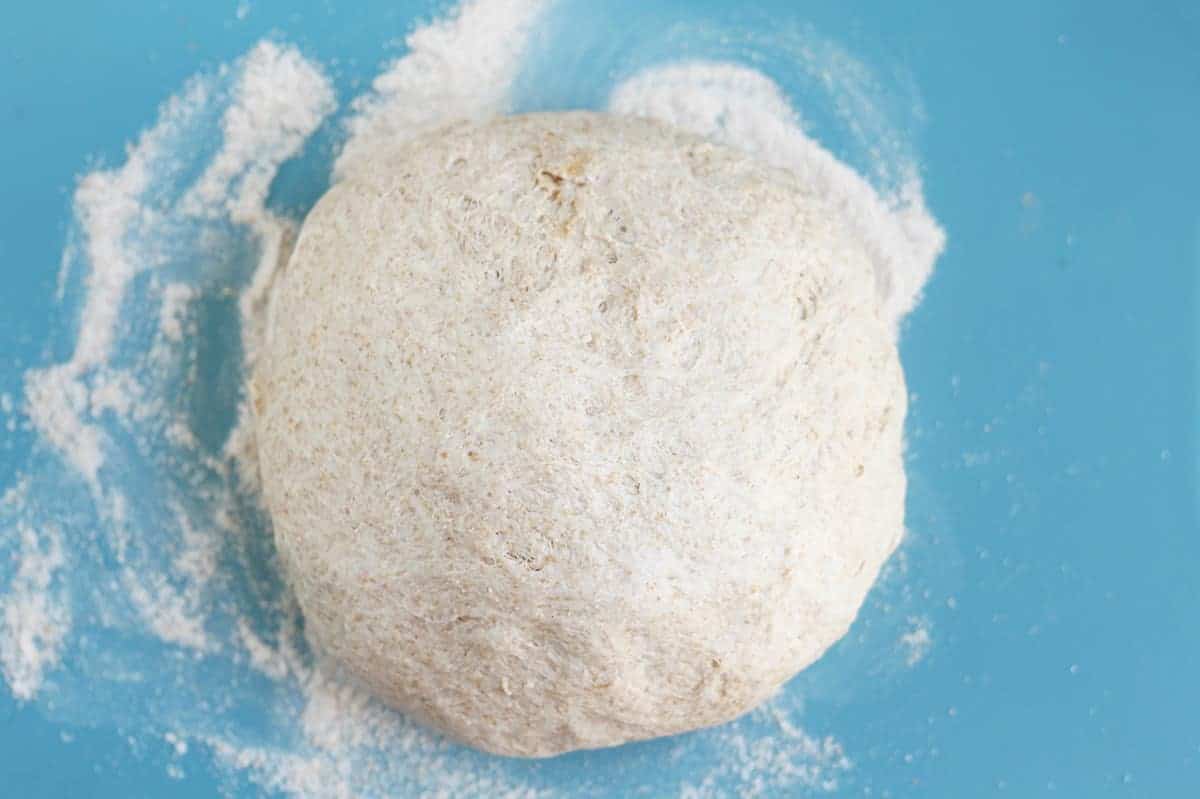 whole-wheat-pizza-dough-on-cutting-board