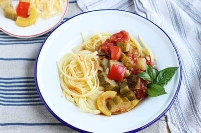 ratatouille with pasta in white bowl