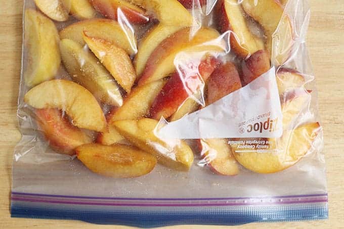 fresh peach slices in freezer bag