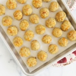 baked chicken meatballs on cookie sheet.