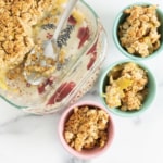 Apple crisp in pan and in three bowls.