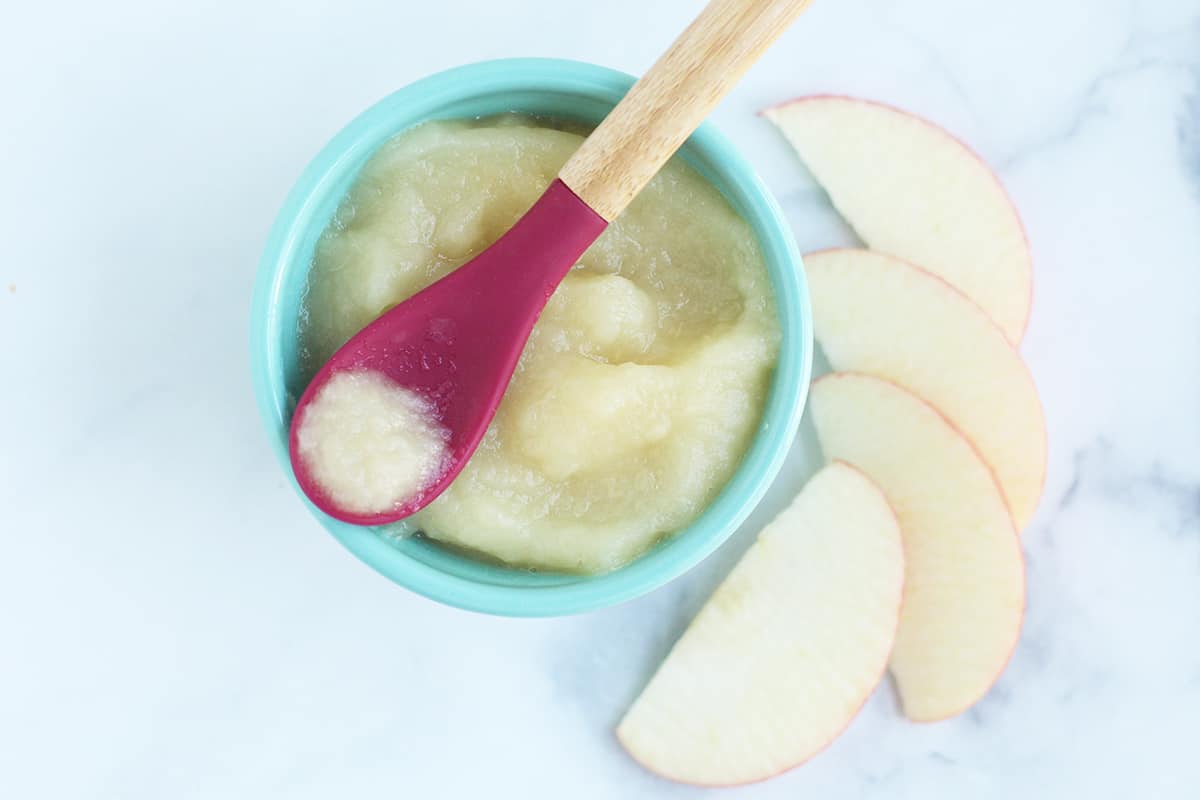 apple-puree-on-red-baby-spoon