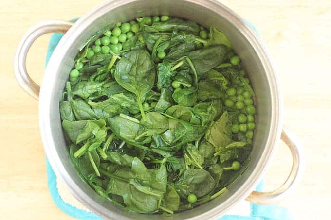 peas-and-spinach-in-pot-with-water