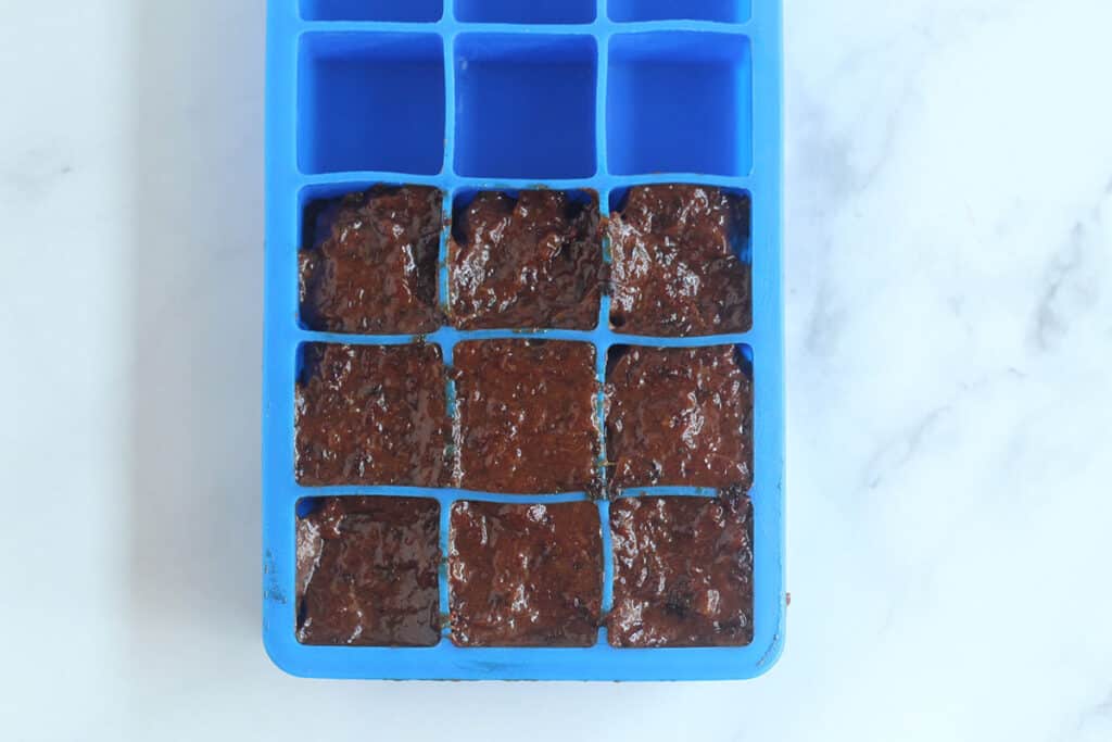 prune puree in silicone ice cube tray.