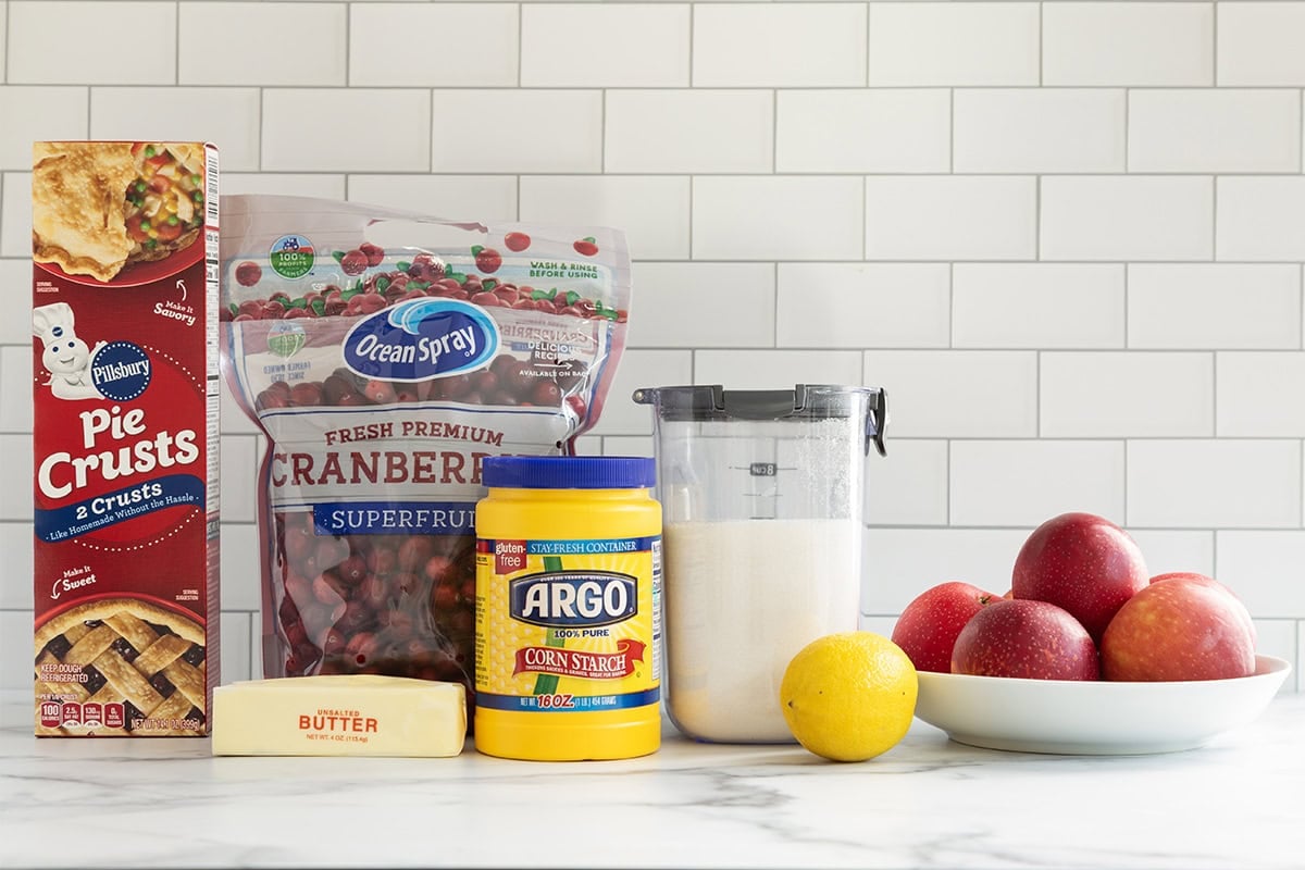 Ingredients for cranberry apple pie on countertop. 