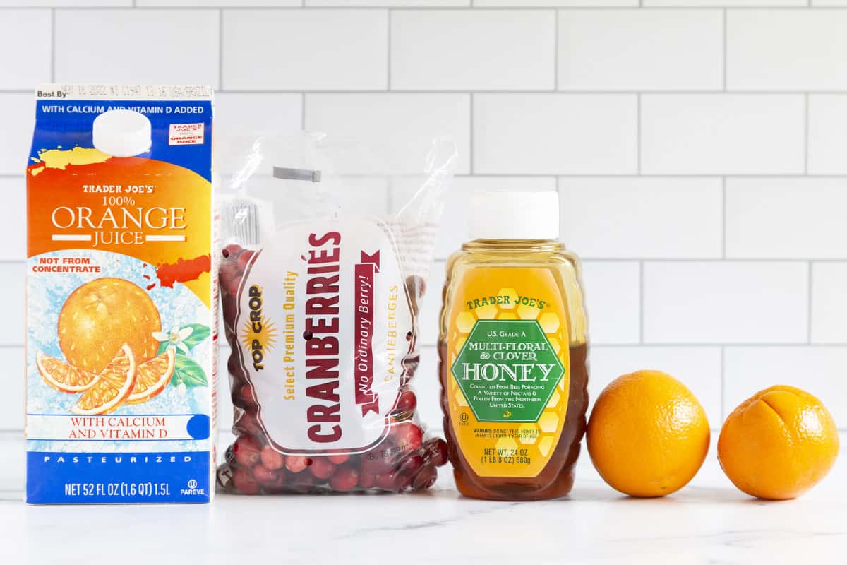 Ingredients for cranberry orange sauce on countertop.