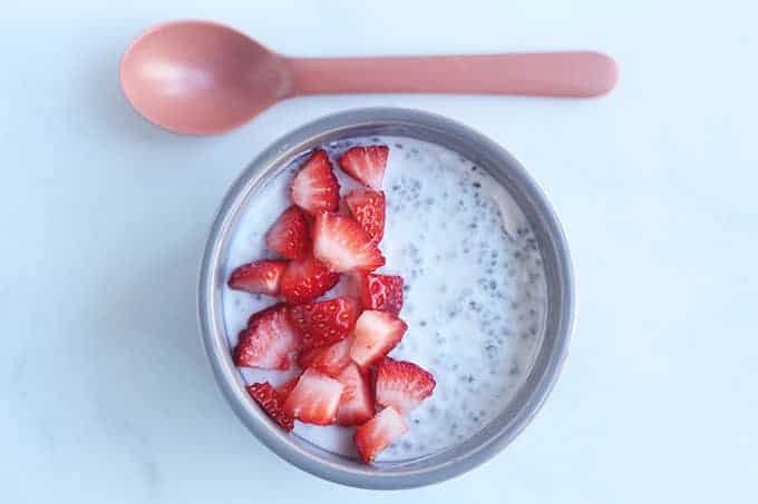 coconut-chia-pudding-with-berries-and-spoon