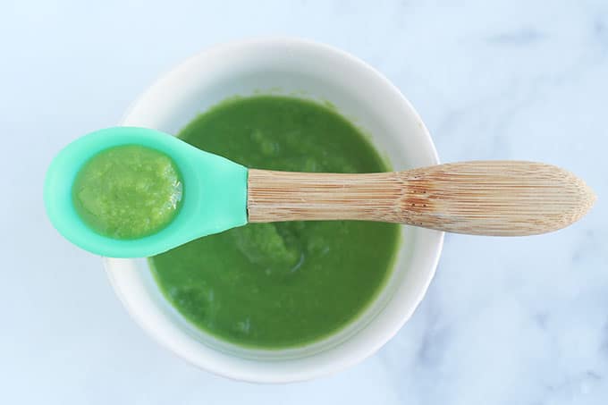 pea baby food on baby spoon