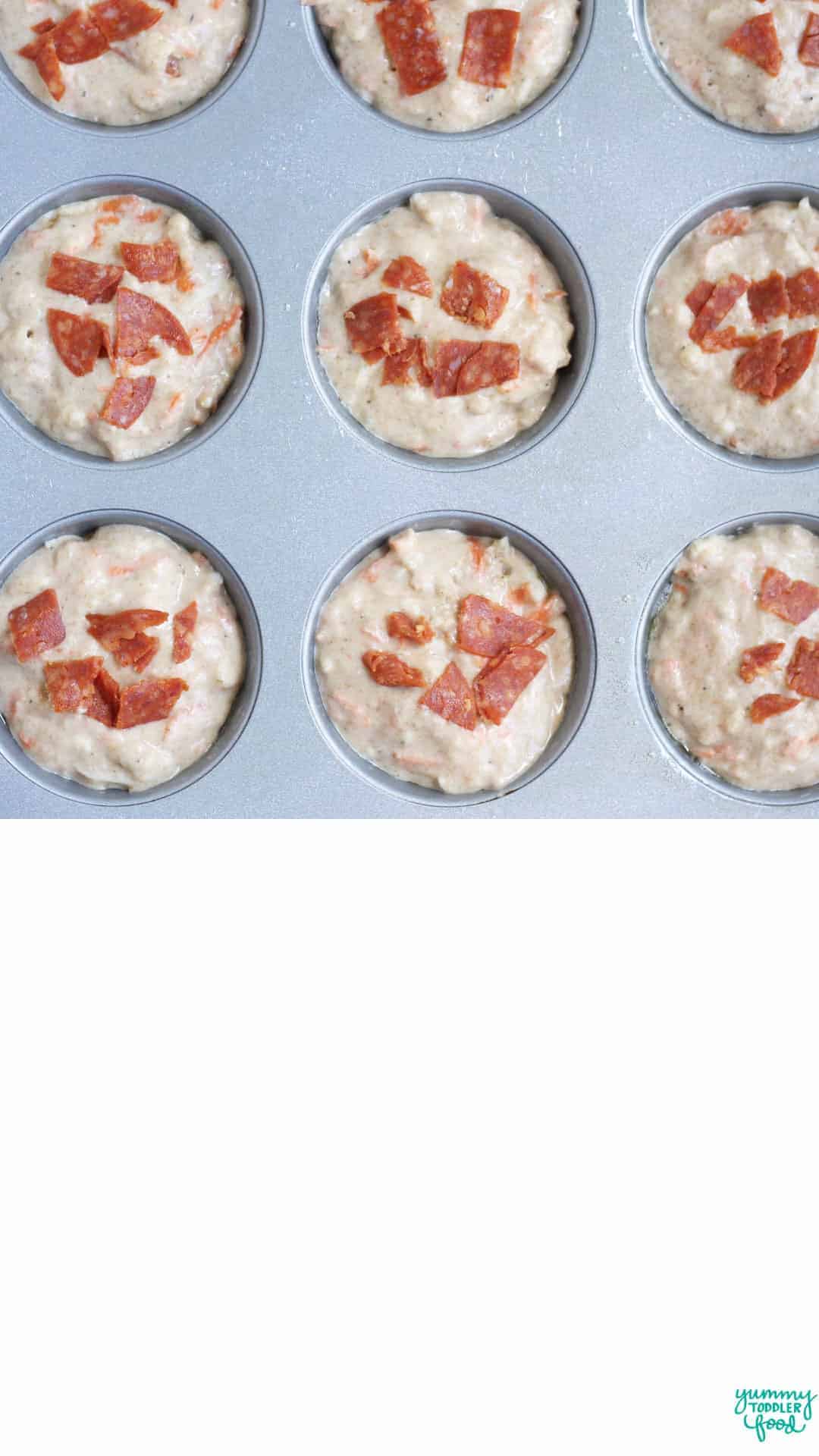 baked pizza muffins in muffin pan.