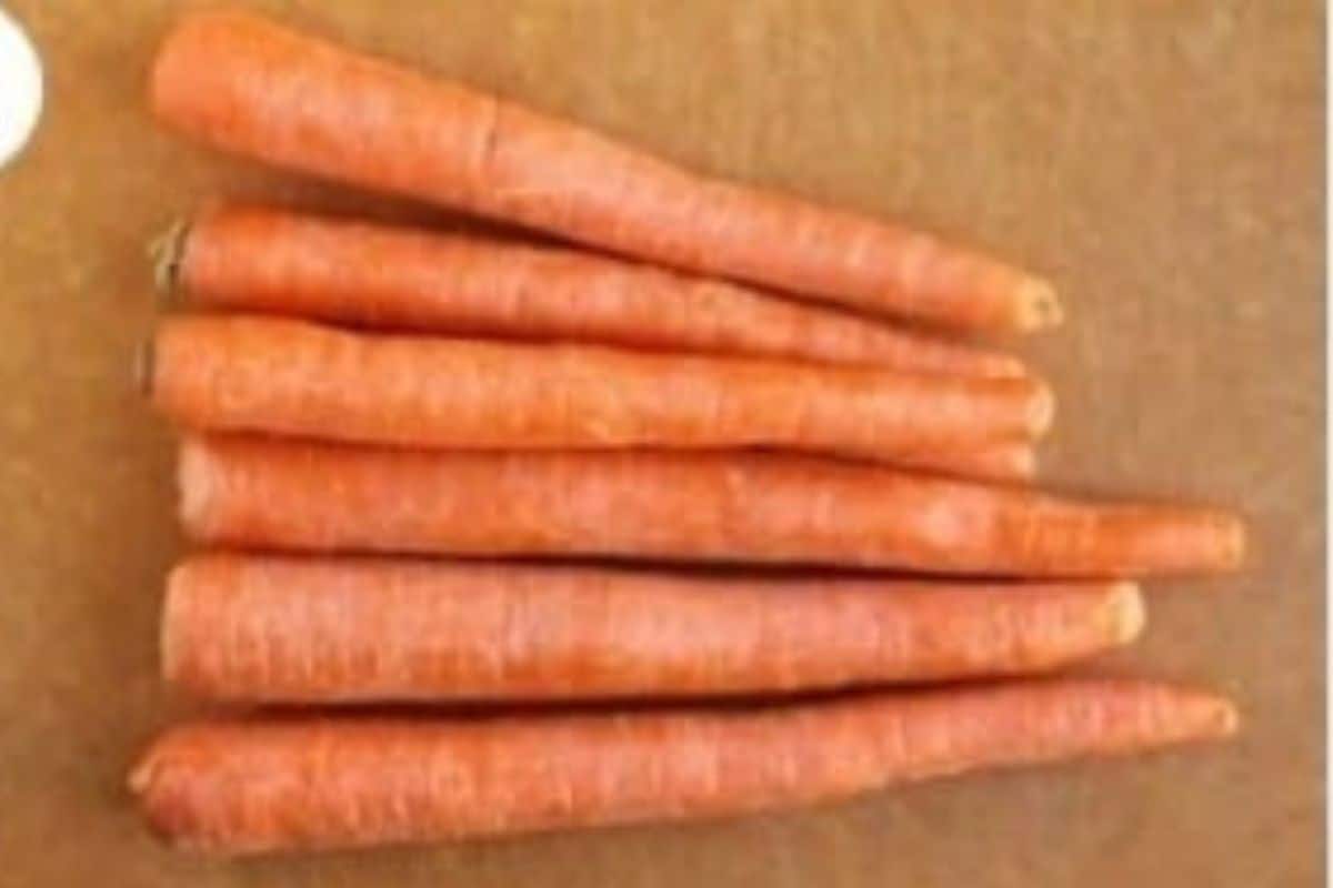 Carrots on cutting board for carrot fries.