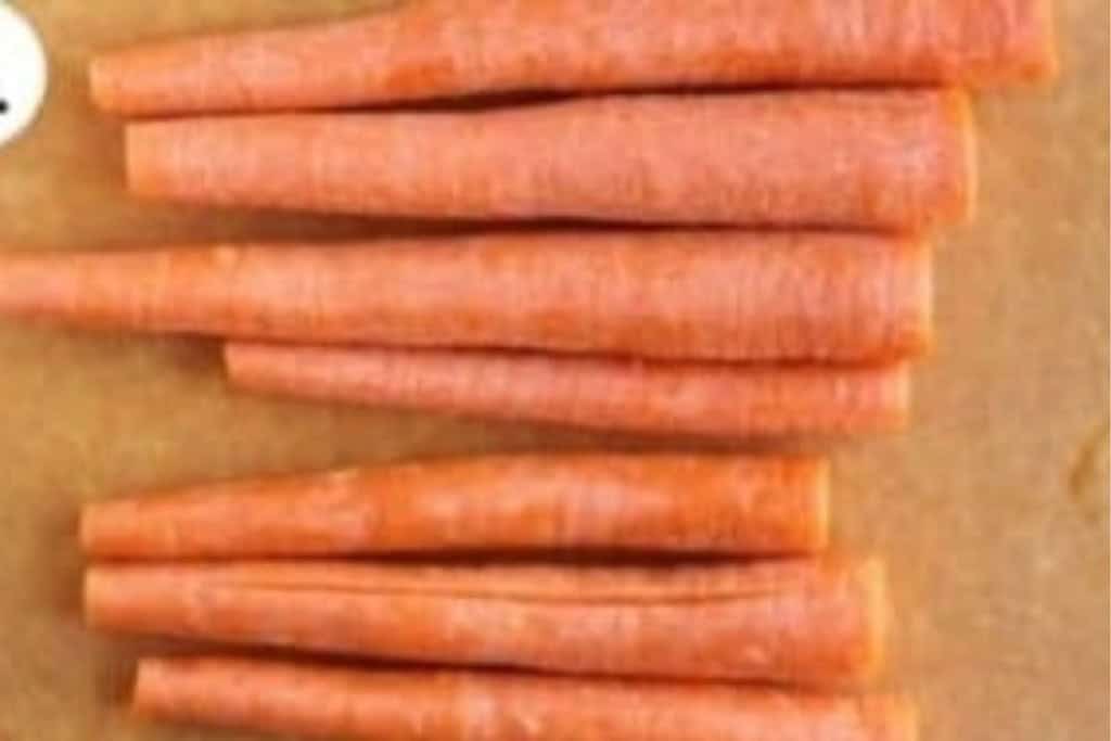 Carrots on cutting board for carrot fries.